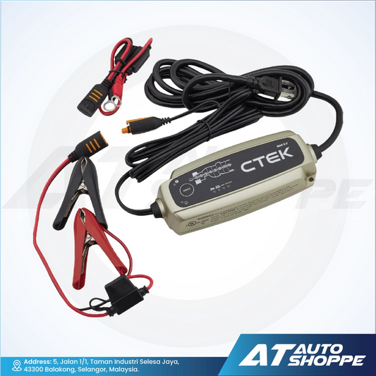 CTEK battery charger with cables and clamps on a white background