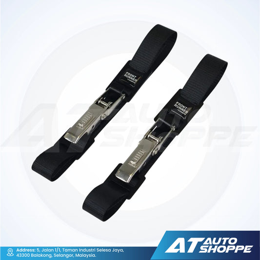 Two black vehicle straps with metal clamps on a white background, featuring the AT Auto Shoppe logo.
