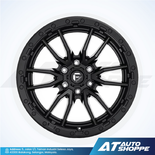 Black alloy wheel on a white background with AT Auto Shoppe branding.