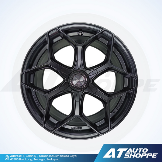 Black alloy wheel on a white background with AT Auto Shoppe branding.