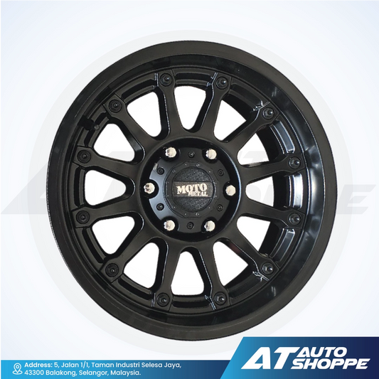 Black alloy wheel with 'Moto Metal' logo on a white background, featuring AT Auto Shoppe branding.