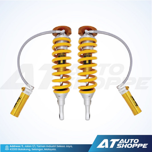 Ohlins yellow coilover absorbers on a white background with AT Auto Shoppe branding.
