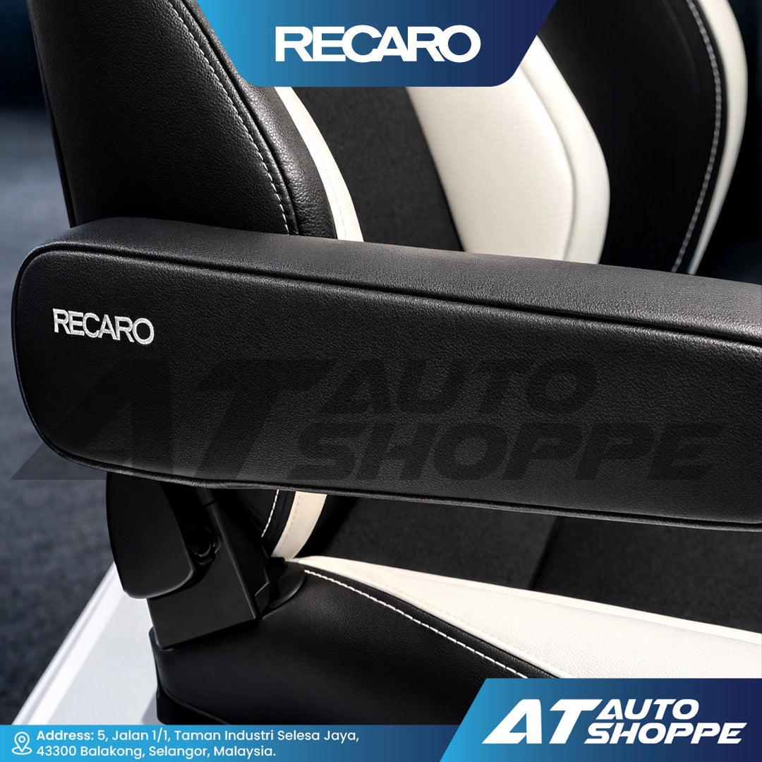 Close-up of a Recaro armrest with visible branding on a dark background.