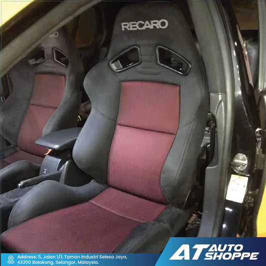 Car interior with Recaro seats and AT Auto Shoppe branding.