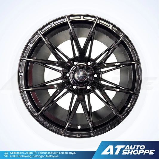 Black alloy wheel on a white background with AT Auto Shoppe branding.