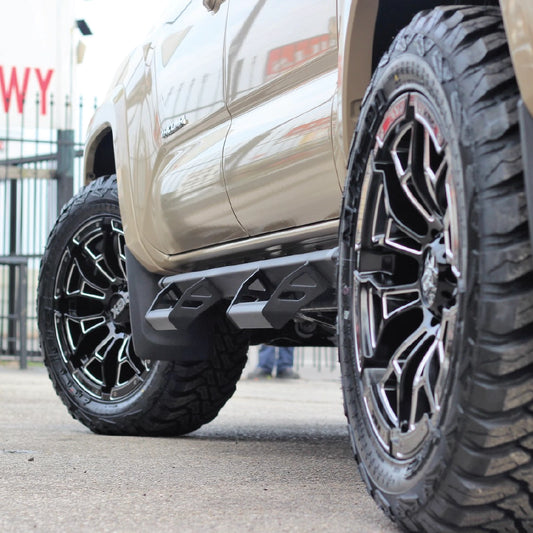 Close-up of a truck's XD wheel and tire with a blurred background