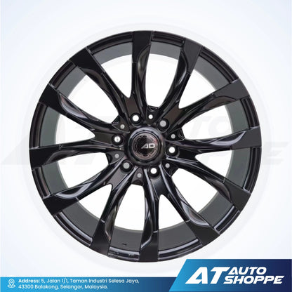 Black alloy wheel with 'AD' branding on a white background, featuring AT Auto Shoppe logo.