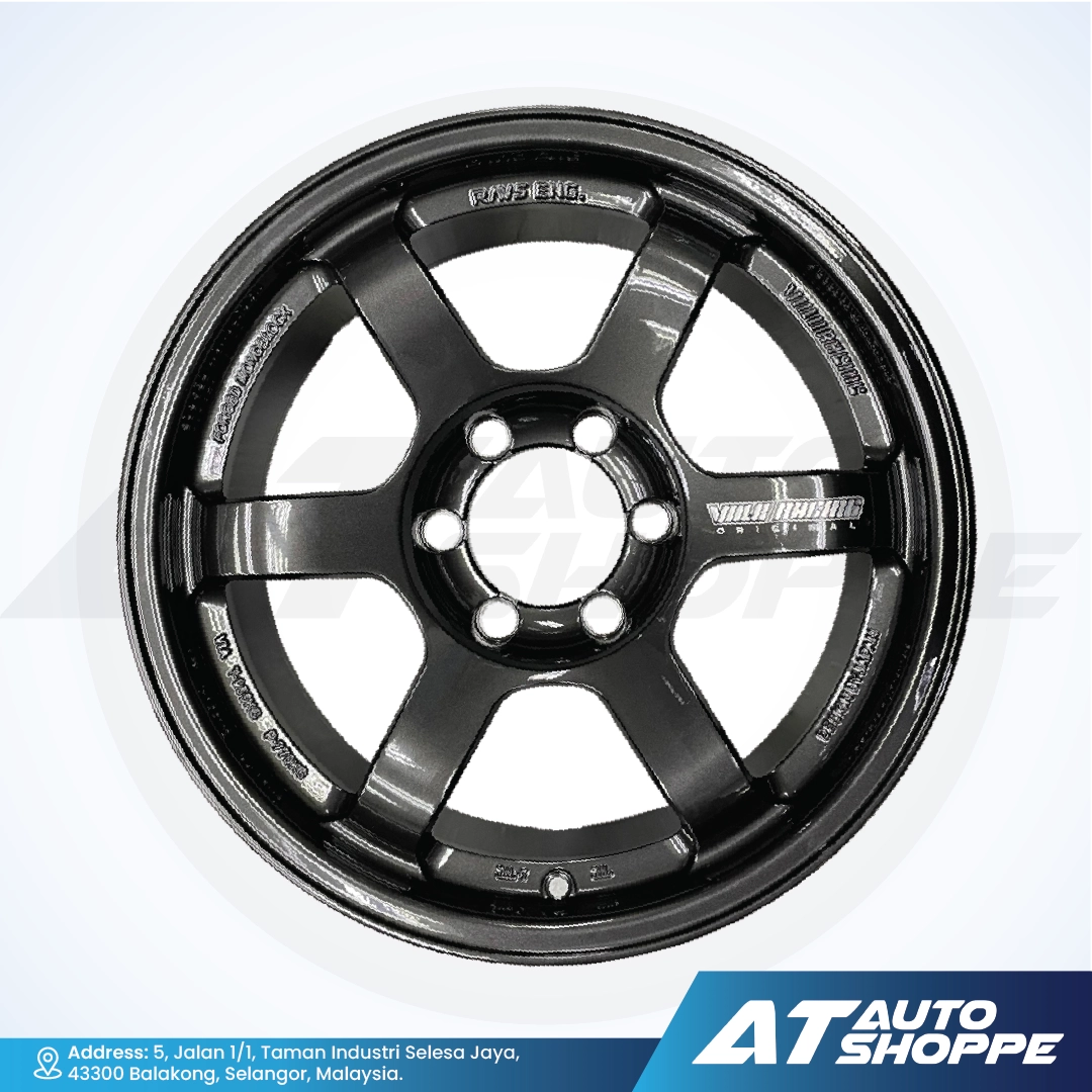 Black alloy wheel on a white background with AT Auto Shoppe branding.