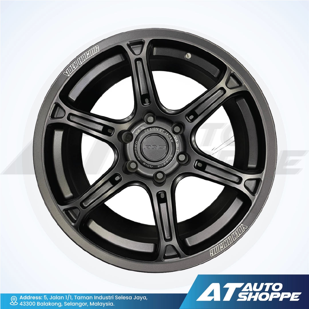 Black alloy wheel with visible branding on a white background