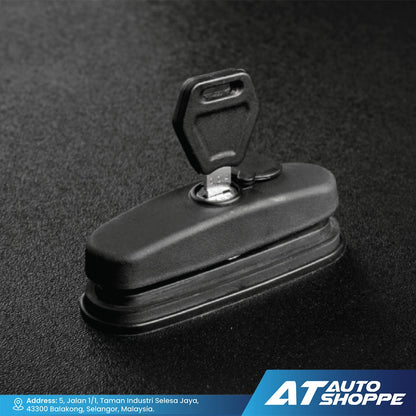 Black car key cover on a dark textured background with AT Auto Shoppe branding.