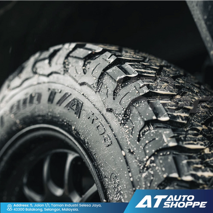 Close-up of a rugged BFGoodrich tire with visible tread pattern, brand logo at the bottom.