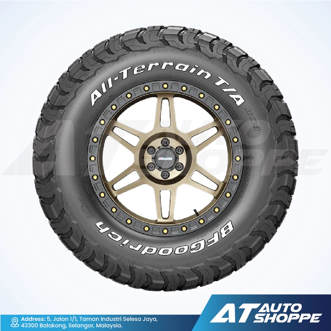 All-terrain BFGoodrich tire with gold rim on a white background, featuring Goodrich branding.