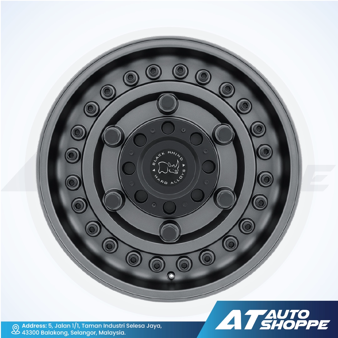 Black alloy wheel on a white background with AT Auto Shoppe branding.