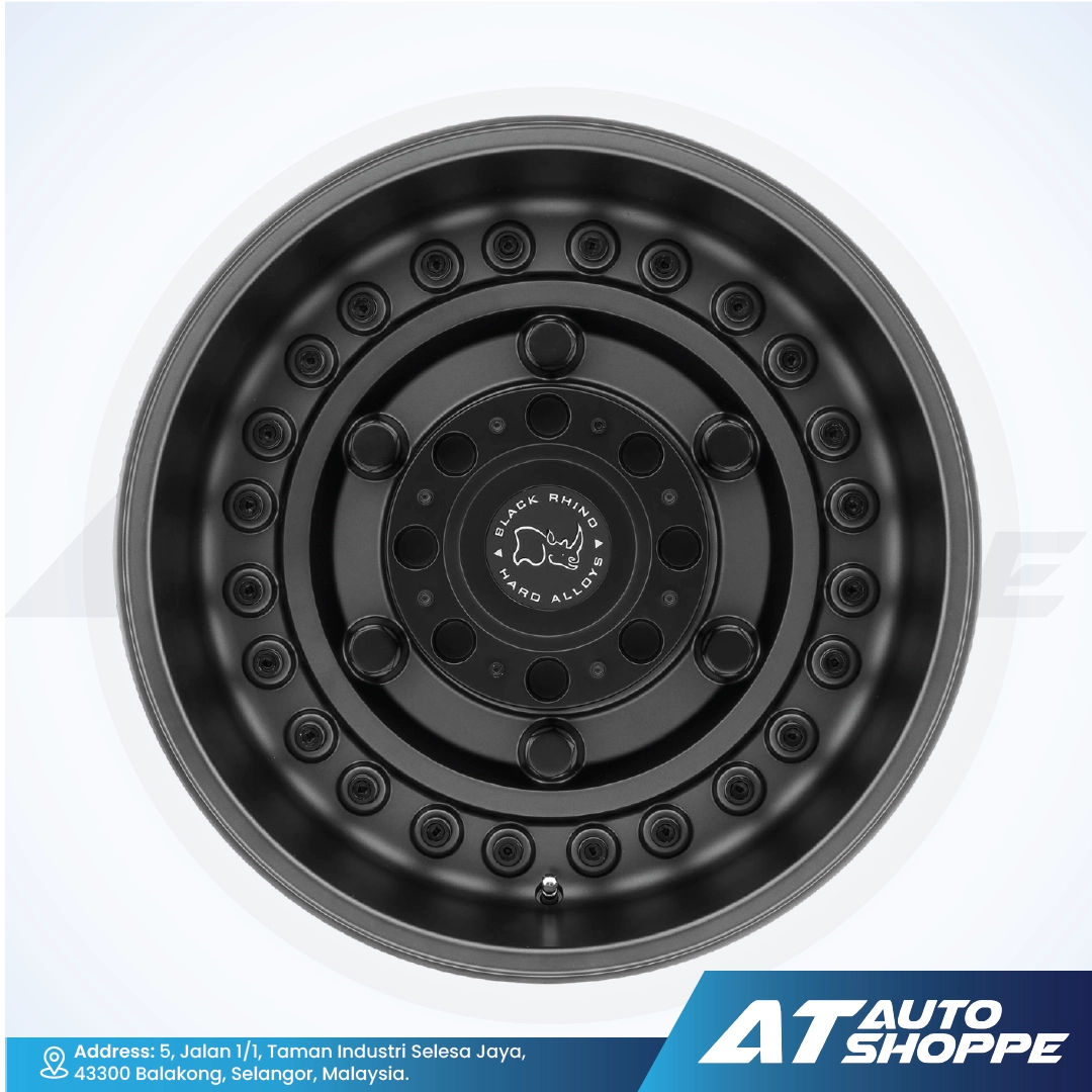 Black alloy wheel on a white background with AT Auto Shoppe branding.