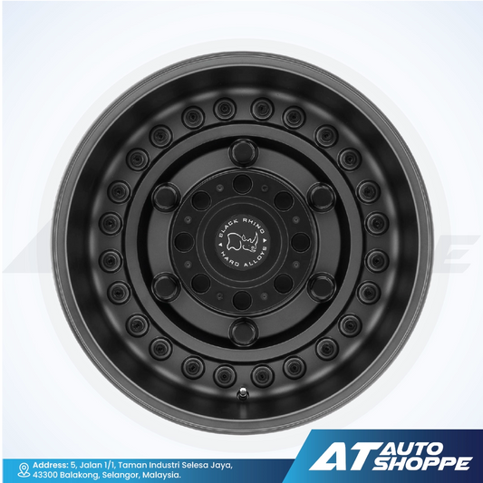 Black alloy wheel on a white background with AT Auto Shoppe branding.