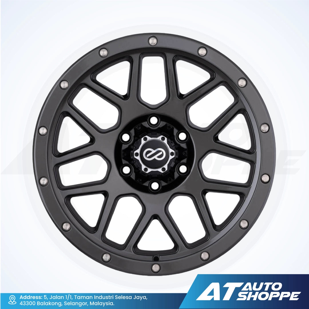 Black alloy wheel with a central logo on a white background, featuring AT Auto Shoppe branding.