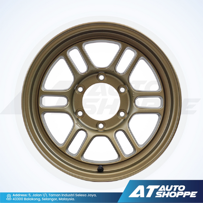 Gold alloy wheel on a white background with AT Auto Shoppe branding.