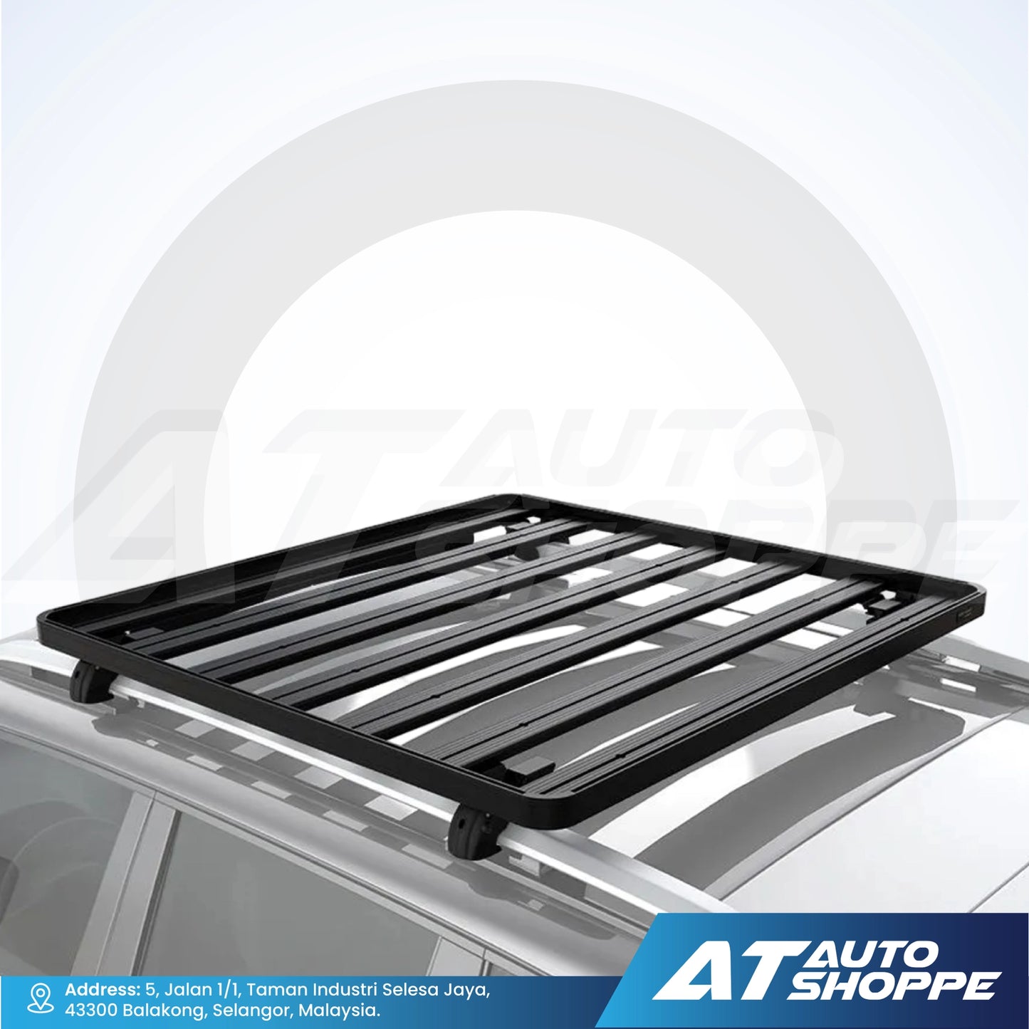 Black roof rack on a car with AT Auto Shoppe branding.