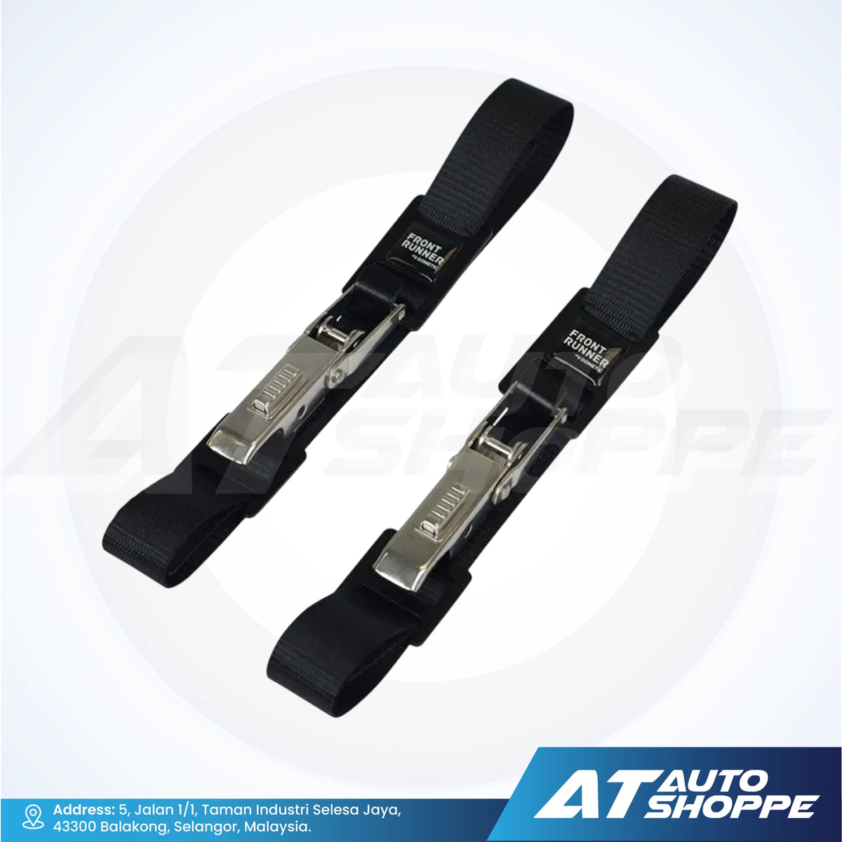 Two black vehicle straps with metal clamps on a white background, featuring the AT Auto Shoppe logo.