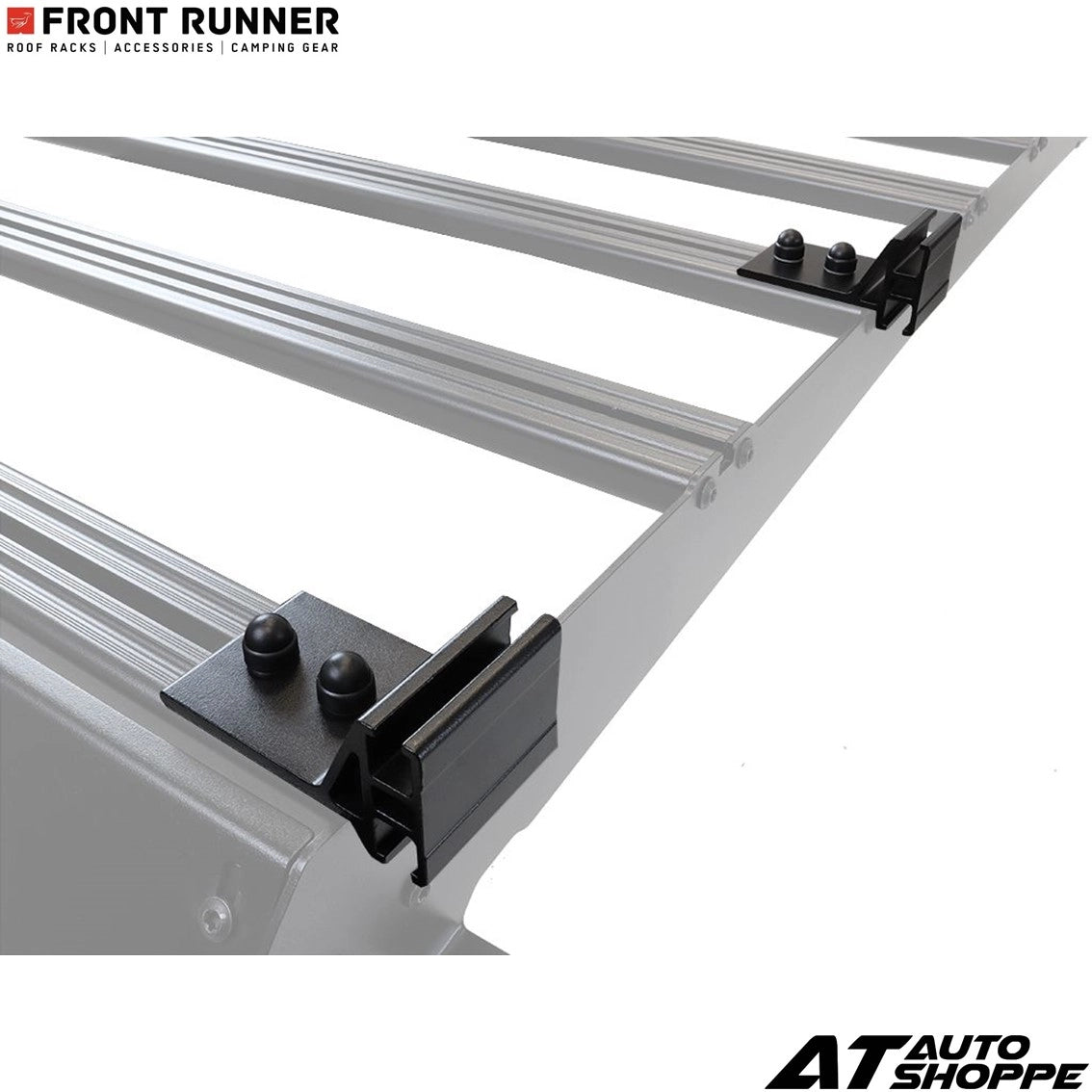 Metal roof rack system with black brackets on a white background, featuring 'Front Runner' and 'AT Auto Shoppe' logos.