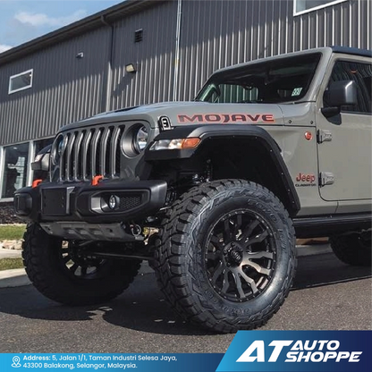 Jeep Mojave parked in front of a building with AT Auto Shoppe branding.