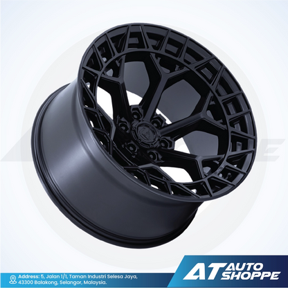 Black alloy wheel on a white background with AT Auto Shoppe branding.