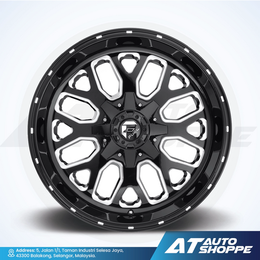 Black alloy wheel with a white rim on a light gray background, featuring the AT Auto Shoppe logo.