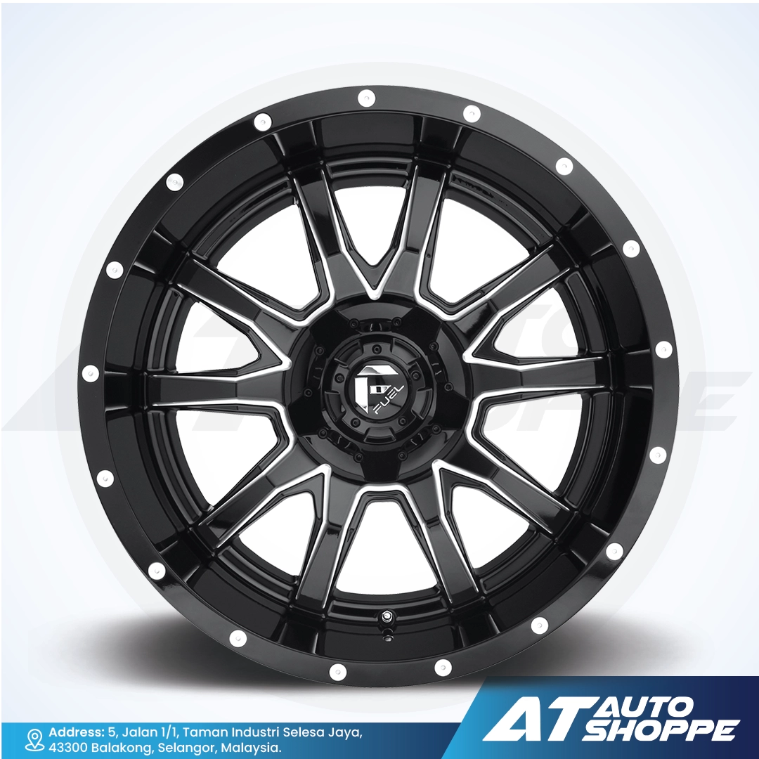 Black alloy wheel on a white background with AT Auto Shoppe branding.