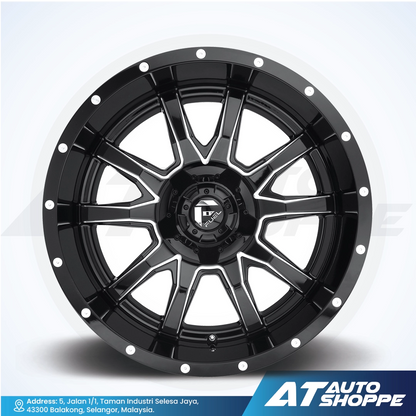 Black alloy wheel on a white background with AT Auto Shoppe branding.