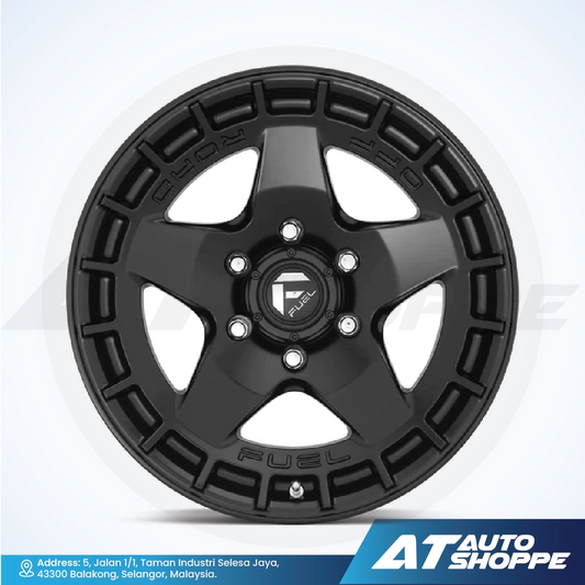 Black alloy wheel on a white background with AT Auto Shoppe branding.