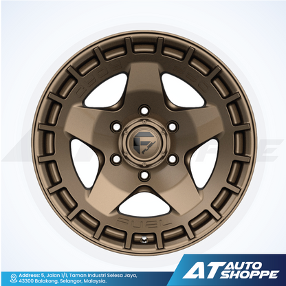 Bronze alloy wheel with star design on a white background, featuring AT Auto Shoppe branding.