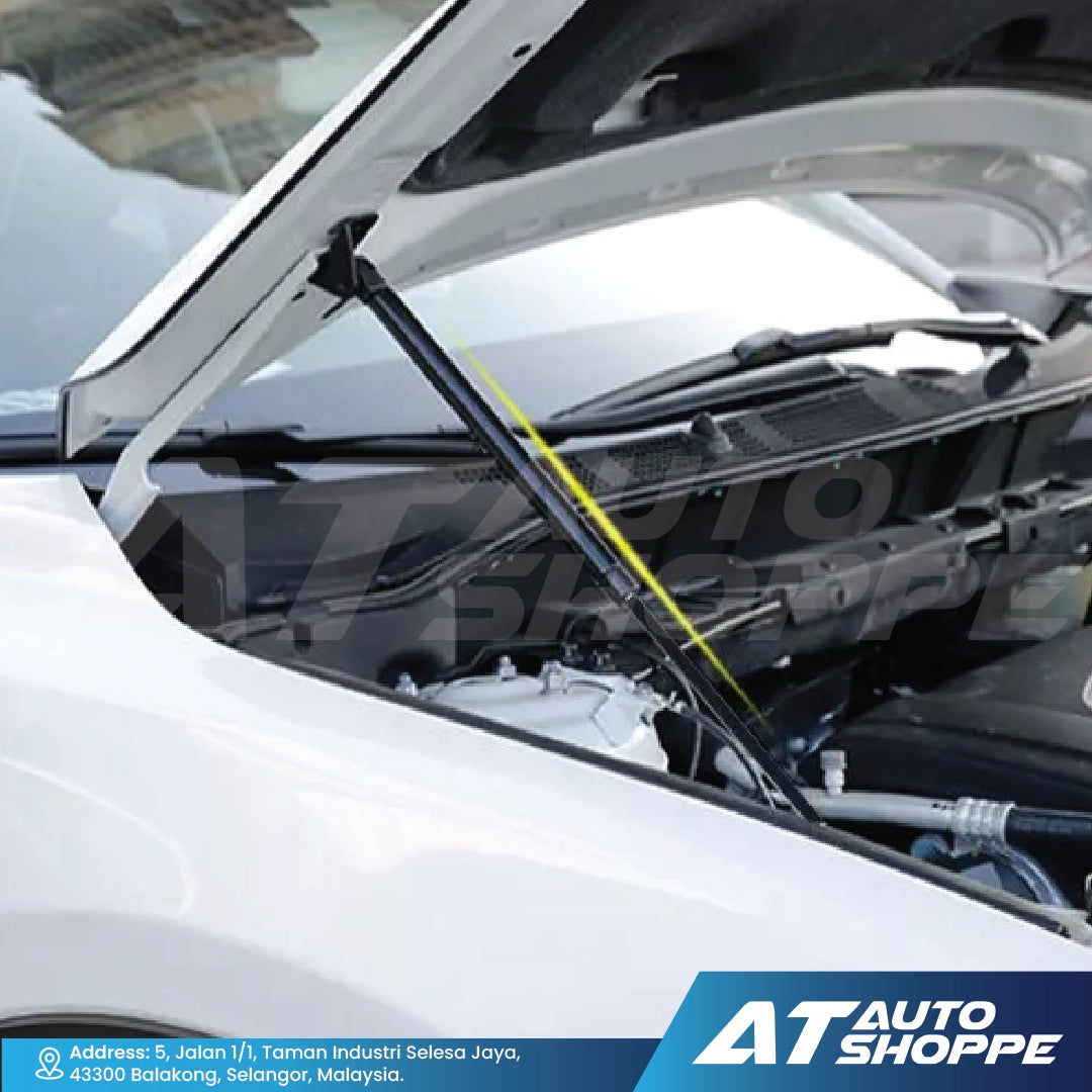 Car hood open with GT Pro strut showing engine components, with AT Auto Shoppe branding.