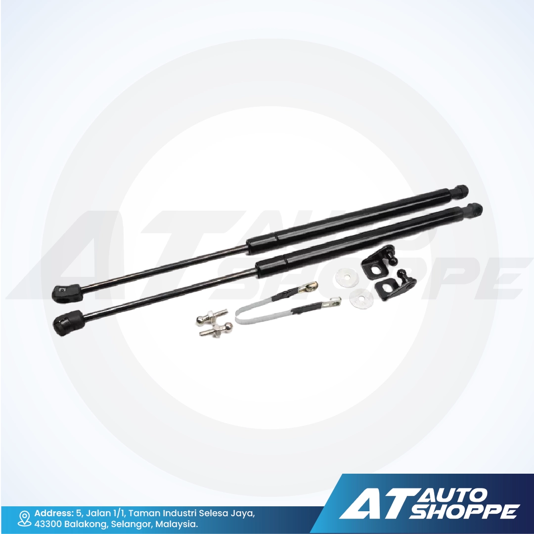 Set of black automotive shock absorbers on a white background with 'AT Auto Shoppe' branding.