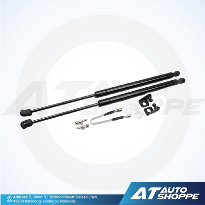 Set of black automotive shock absorbers on a white background with 'AT Auto Shoppe' branding.