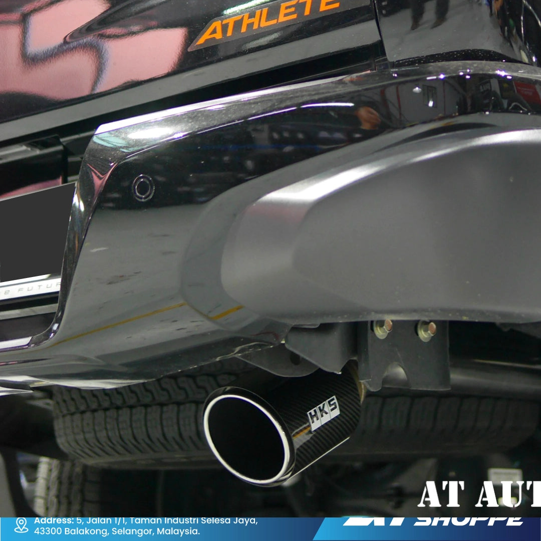 Close-up of a car exhaust system with 'HKS' branding.