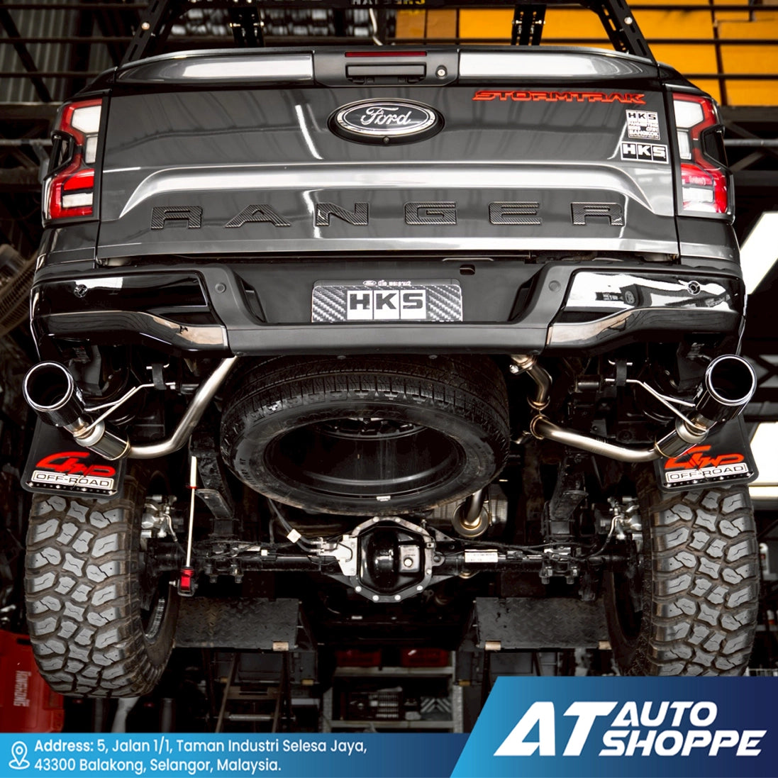 Back view of a black Ford Ranger truck with visible branding and customization details.