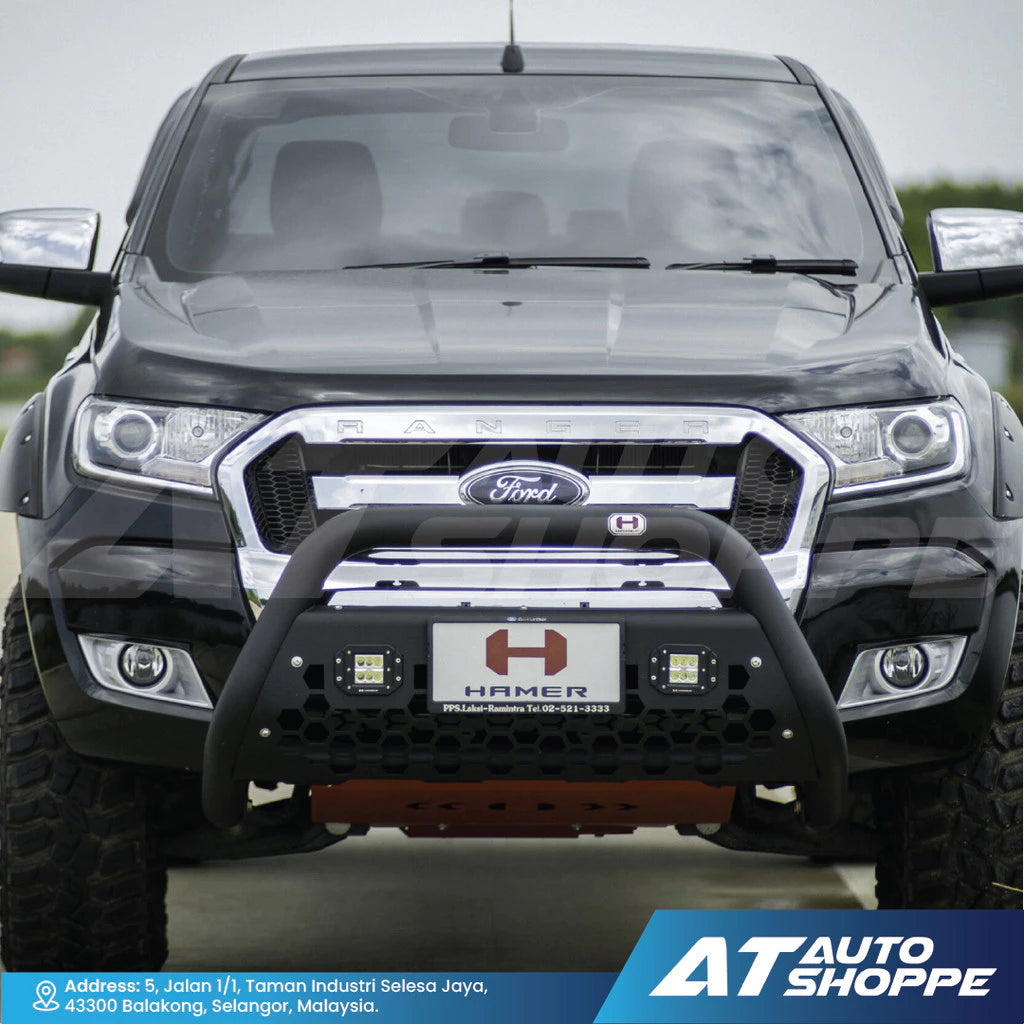 Front view of a Ford vehicle with a bumper guard and 'Hamer' logo, featuring AT Auto Shoppe branding.