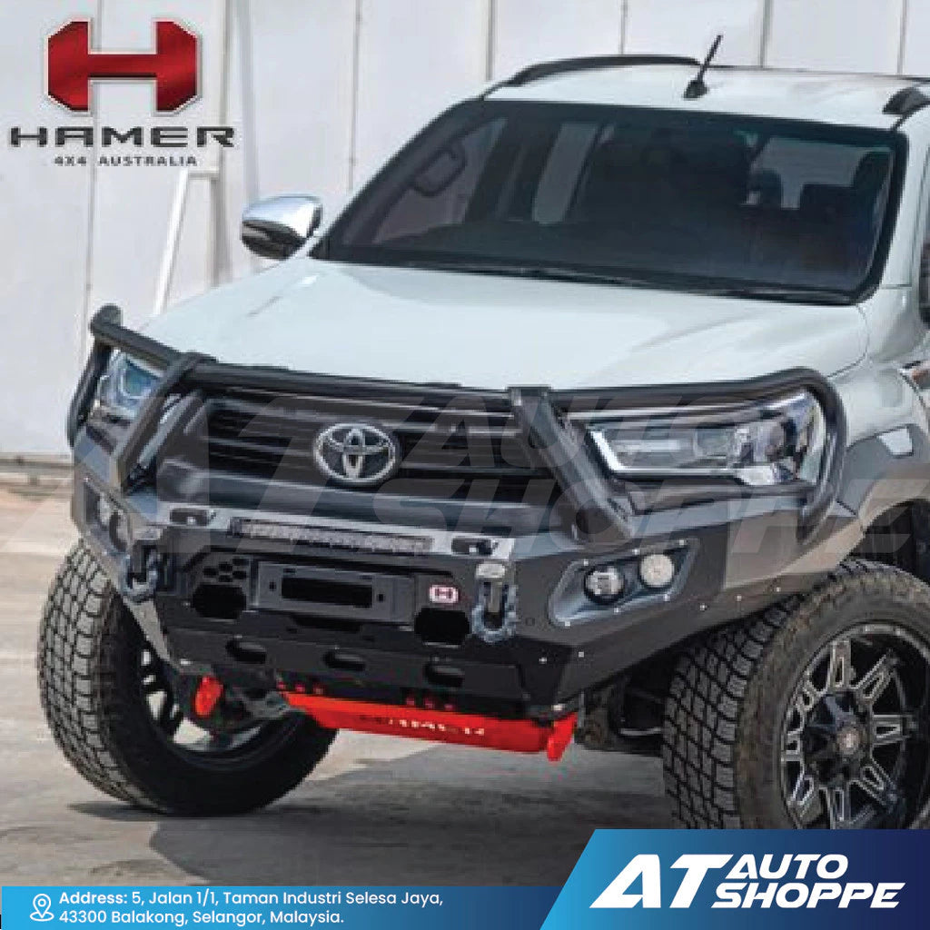 White Toyota truck with a black front bumper and 'Hamer 4x4 Australia' branding.