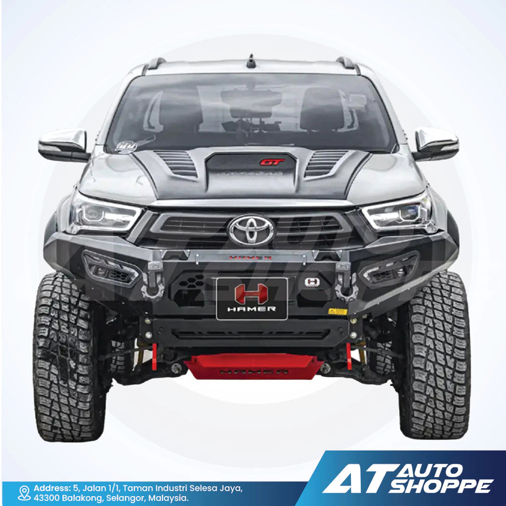 Toyota Hilux with added features on a white background, featuring the brand 'AT Auto Shoppe'.