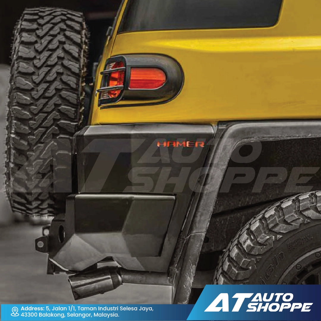 Close-up of a yellow vehicle's rear with a visible brand logo at the bottom.