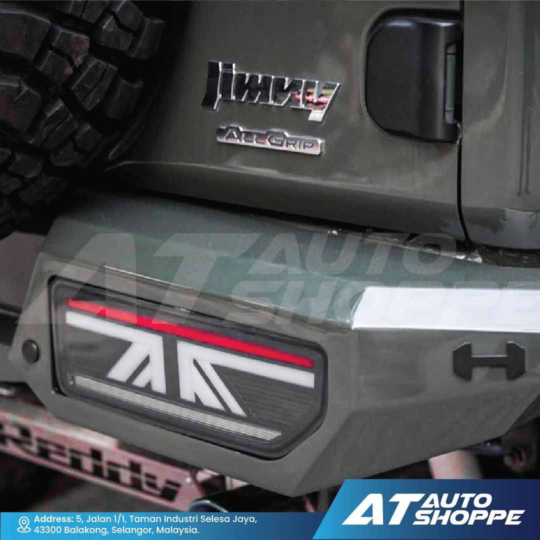 Close-up of a vehicle's rear with All Terrain Traction (AT) logo and 'All Grip' branding.