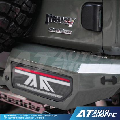 Close-up of a vehicle's rear with All Terrain Traction (AT) logo and 'All Grip' branding.