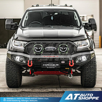 Front view of a black Ford vehicle with 'Hamer' accessories in a garage setting.