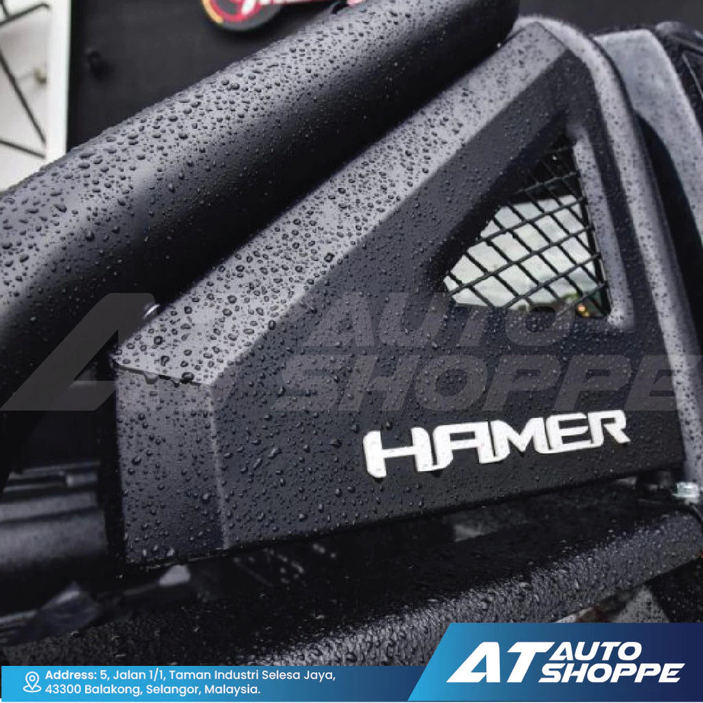 Close-up of a black air filter with 'Hamer' branding, featuring water droplets.