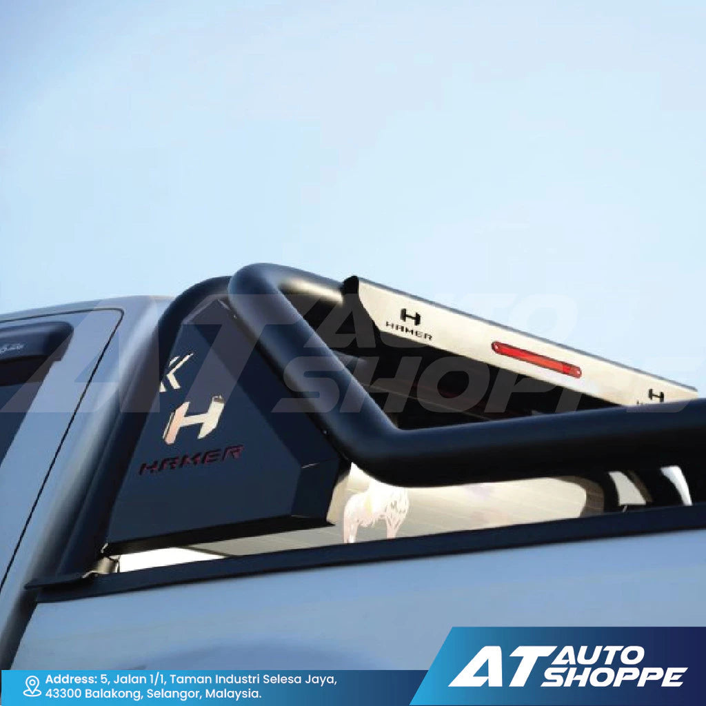 Black vehicle roof rack with 'H' logo on a clear blue sky background, featuring AT Auto Shoppe branding.