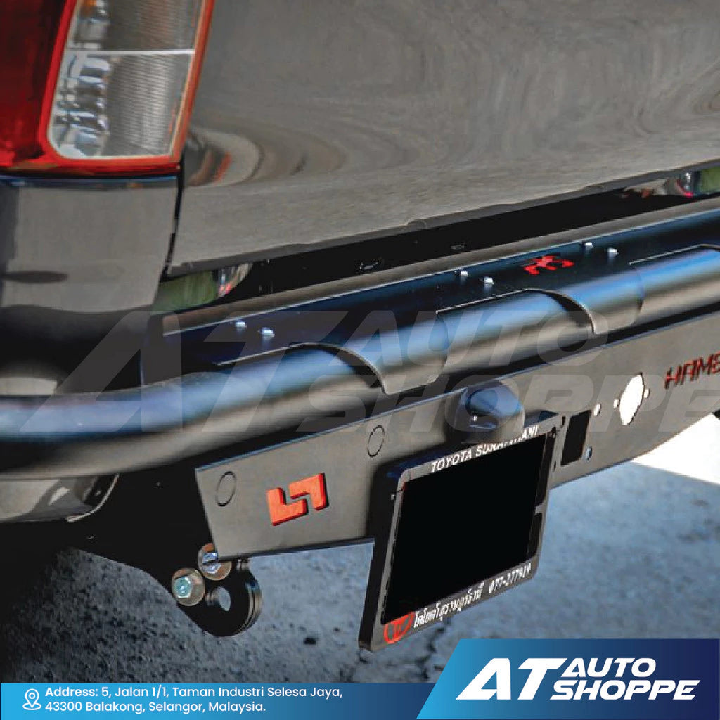 Tow bar with Toyota logo on a vehicle, branded with AT Auto Shoppe.