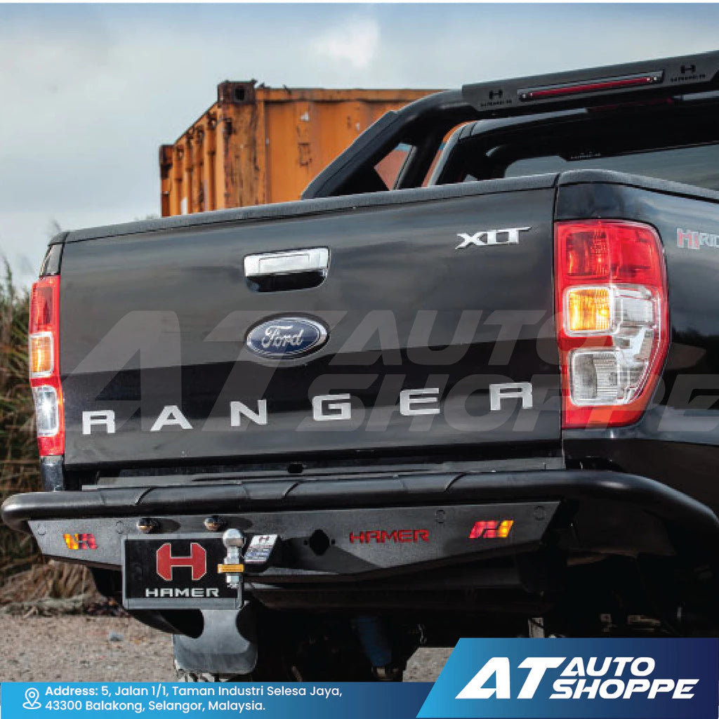 Back view of a Ford Ranger truck with 'AT Auto Shoppe' branding.