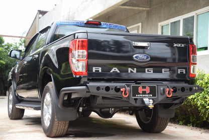 Black Ford Ranger truck with 'H' Hammer bumper in a driveway.