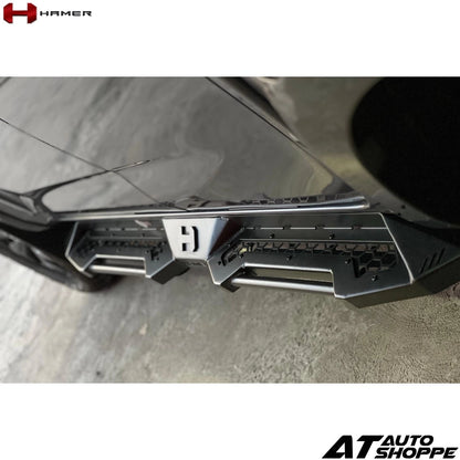 Close-up of a car bumper with a visible brand logo on a white background