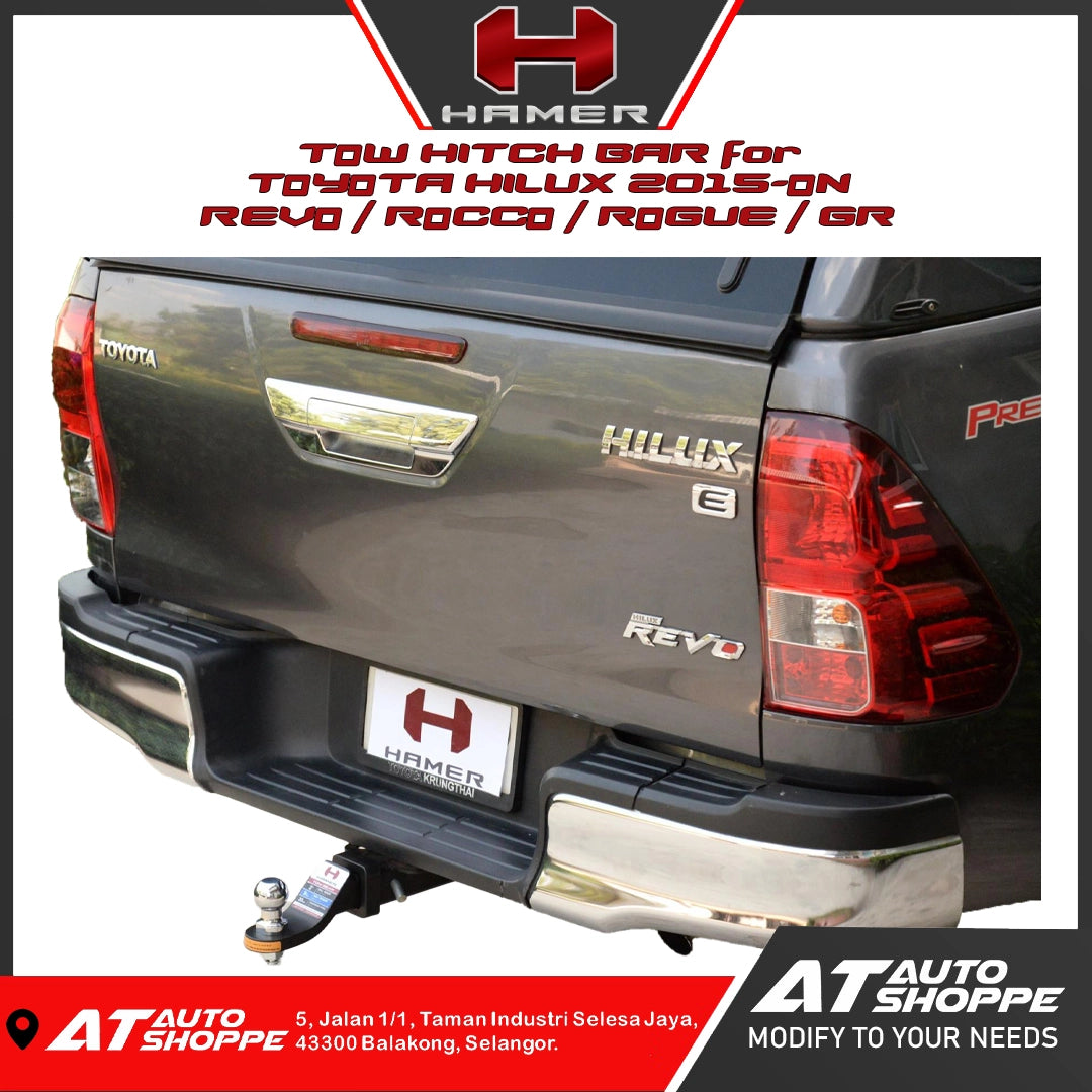 Toyota Hilux with a tow hitch bar labeled 'Hammer' on a white background.